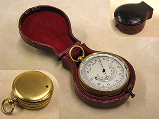 Late 19th century pocket barometer with curved thermometer in outer case